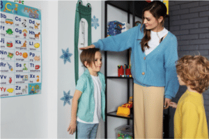 Teacher measuring student height