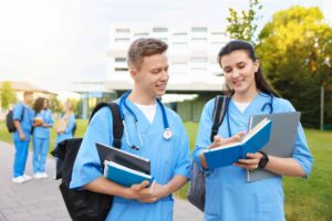 Nurse Aide Training by State two medical students in blue scrubs studying outdo utc scaled